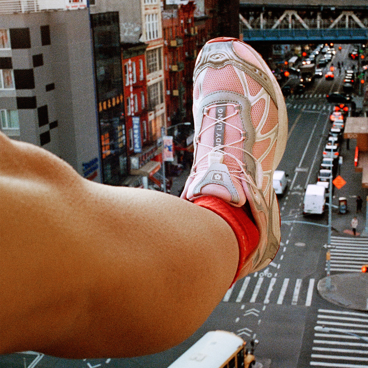 Model shows off pink Salomon shoes